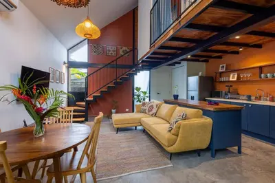 a living room with a couch and a table at Casa Mariola the blissful studio in Mal País