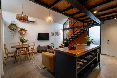 a living room with a kitchen and a dining room at Casa Mariola the blissful studio in Mal País