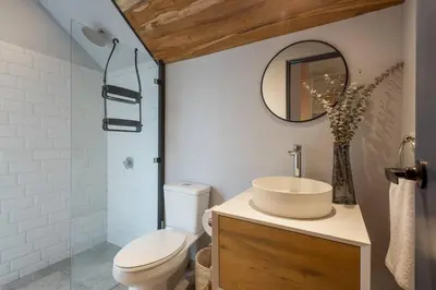 a bathroom with a toilet and a sink and a mirror at Casa Mariola the blissful studio in Mal País