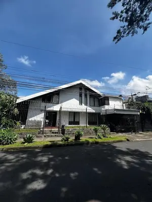 a large white building with a street in front of it at Casa Aldaba in San José