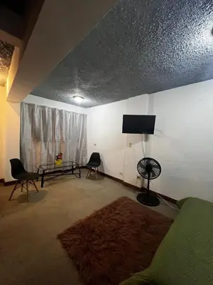 a living room with a couch and a table at Casa Aldaba in San José