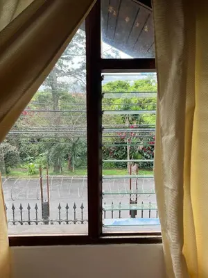 a window in a room with a view of a street at Casa Aldaba in San José