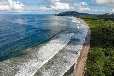 an aerial view of the shoreline of a beach at Steps to the Main Surf Break - Casita 1 Dos Hijas in Refundores