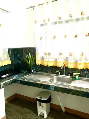 a kitchen with a sink and a window at Miravalles Country House in Guayabal