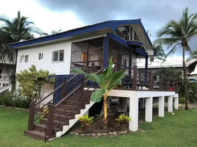 a house with a staircase leading up to it at #01 - Amazing Beachfront Bungalow!!!! in Playa Hermosa