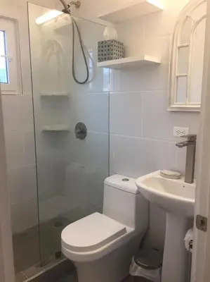 a bathroom with a shower and a toilet and a sink at #01 - Amazing Beachfront Bungalow!!!! in Playa Hermosa