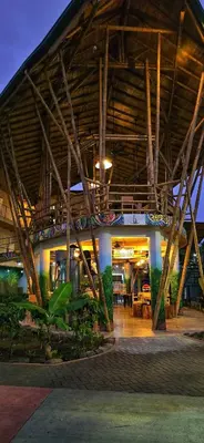 a building with a roof with wooden beams at Bonding Coffee Roaster Café & Hotel in Quepos
