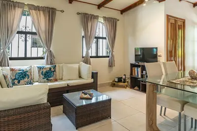 a living room with a couch and a table at Casa BEA 1 in Sámara