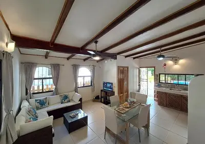 a living room with couches and chairs and a table at Casa BEA 1 in Sámara