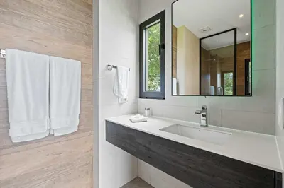 a bathroom with a sink and a mirror at Amazing Ocean and Mountain Views in Tamarindo