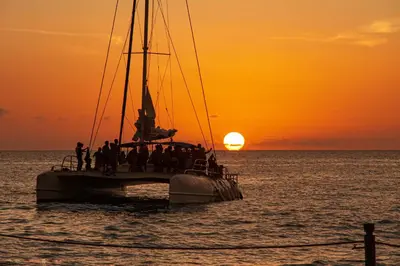 a group of people on a boat in the ocean at sunset at Amazing Ocean and Mountain Views in Tamarindo