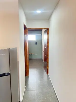 an empty hallway with a door leading to a room at Marea Baja73 in Puntarenas