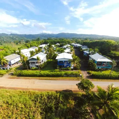 an aerial view of a resort with houses and trees at #8 Ocean view Beach Front Bungalow 2nd Row in Playa Hermosa