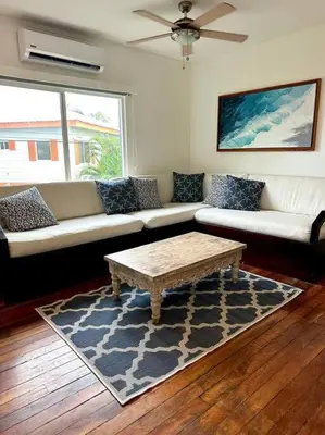 a living room with a couch and a coffee table at #8 Ocean view Beach Front Bungalow 2nd Row in Playa Hermosa