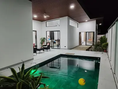 a house with a swimming pool in a living room at Casa Pacifica in Uvita
