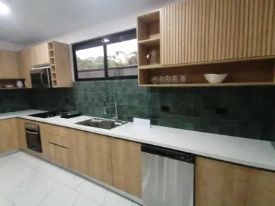 a kitchen with a sink and a dishwasher at Casa Pacifica in Uvita