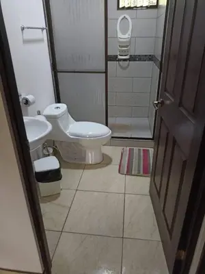 a bathroom with a toilet and a sink at Casa huéspedes Noe in Coronado