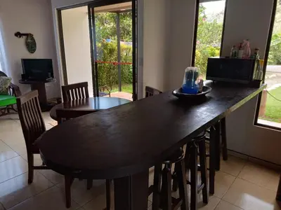 a dining room with a large wooden table and chairs at Casa huéspedes Noe in Coronado