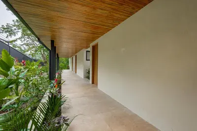 a hallway of a house with a wooden ceiling at Villa Bahia Oceanview Designer Retreat Malpais in Mal País