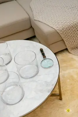 a white table with glasses and a bottle on it at Escalante Executive Studio AC in San José