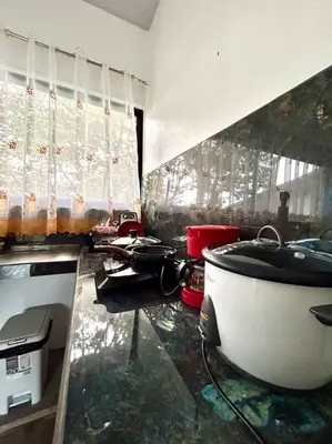 a kitchen with a sink and a tub in a room at Miravalles Tiny House in Upala