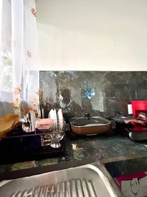 a bathroom with a sink and a bath tub at Miravalles Tiny House in Upala