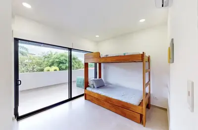 a room with a bunk bed in a house at Casa Corales Dreams Deluxe in Playa Flamingo