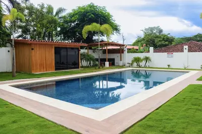 a swimming pool in the yard of a house at Casa Corales Dreams Deluxe in Playa Flamingo