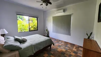 a bedroom with a bed and a window at Casa tipica in Fortuna