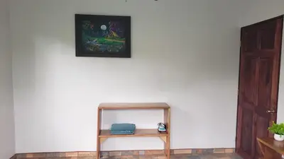 a shelf against a wall with a picture on the wall at Casa tipica in Fortuna