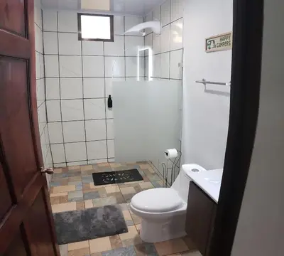 a small bathroom with a toilet and a sink at Casa tipica in Fortuna