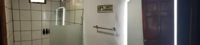 a bathroom with a door with a sign on it at Casa tipica in Fortuna