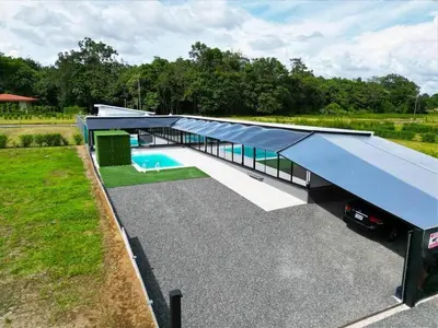 an overhead view of a large house with a blue roof at Casa Cristal # 1 in Fortuna