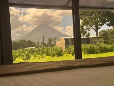 a view of a mountain through a window at Casa Cristal # 1 in Fortuna