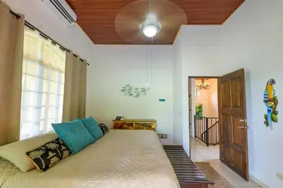 a living room with a couch and a window at Jungle & Beach Retreat Villa Tranquilo in Esterillos Este
