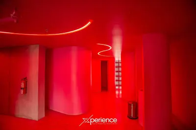 a red room with red lights and a red wall at Jungle at 24, City Views and Wonderland Vibes! in Hatillo