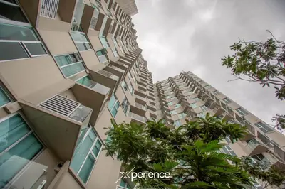 a tall building with trees in front of it at Firefly at 29, City Views and Wonderland Vibes! in Hatillo