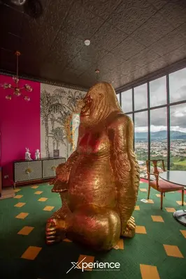a large statue of a bear sitting on a potty at Bloum at 22, City Views and Wonderland Vibes! in Hatillo