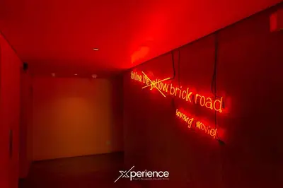 a room with red neon signs on the wall at Blue Nun at 29, City Views and Wonderland Vibes! in Hatillo