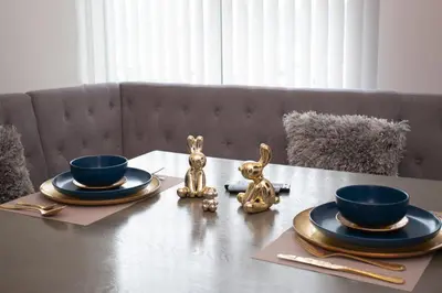 a table with two plates and two bowls on it at Gold Rabbit at 26, City Views and Wonderland Vibes! in Hatillo