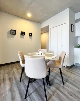 a dining room with a table and chairs at Serenity at 12, City Views and Wonderland Vibes! in Hatillo