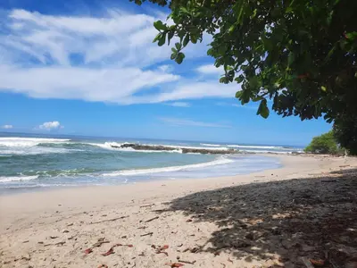 a beach with the ocean in the background at Casa Mor - Surfhouse - 2 min from the beach in Santa Teresa Beach