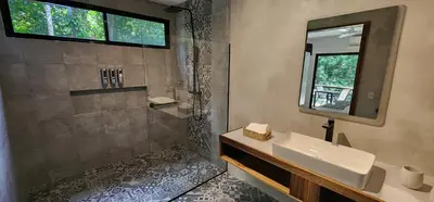 a bathroom with a sink and a mirror at Hotel Evasión in Ojochal