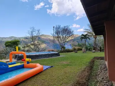 a playground in a yard with a play set at Casita en la finca Los Bambú in Jaris