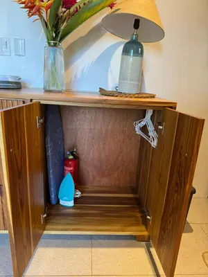 a cabinet with a vase on top of it at Casa Rucca in Uvita