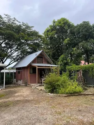a small red house with a metal roof at Nosara Hemp House in Nosara