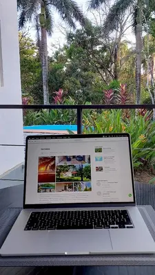 a laptop computer sitting on top of a table at Villas Pura Vida - Guapinol in Río Negro
