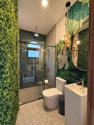 a bathroom with a toilet and a shower and a sink at Luxury villa on the Cloud Forest Infinity Pool in Monteverde Costa Rica