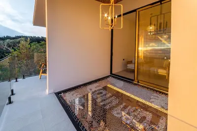 a room with a swimming pool on a balcony at Luxury villa on the Cloud Forest Infinity Pool in Monteverde Costa Rica