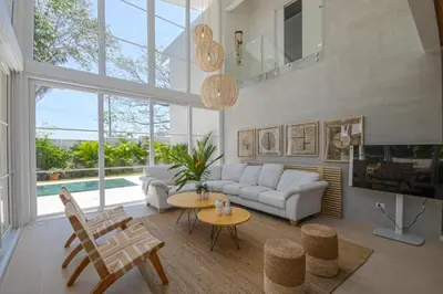 a living room with a couch and a table at Villa Calula in Playa Hermosa